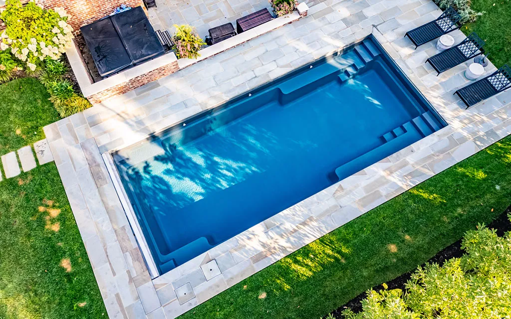 Drone view of a Leisure Pools inground fiberglass pool Expert Pool Builders Who Listen: The Leisure Pools Difference